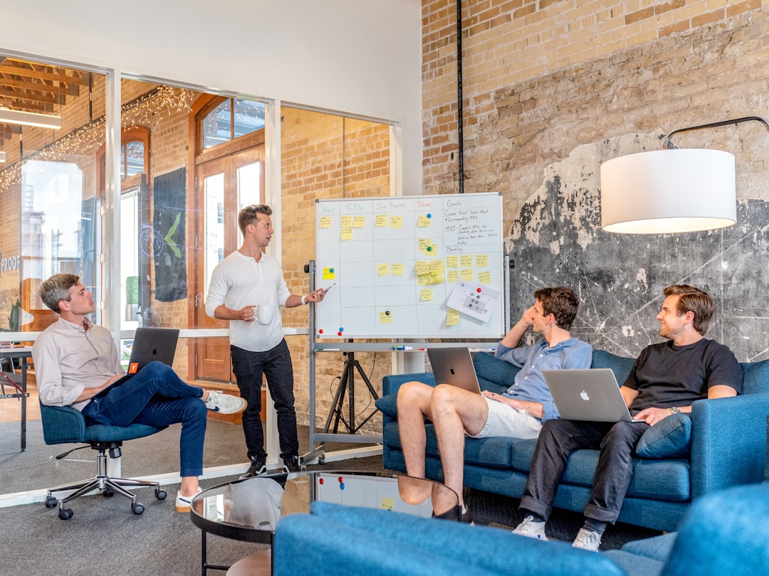 team in business presentation at whiteboard