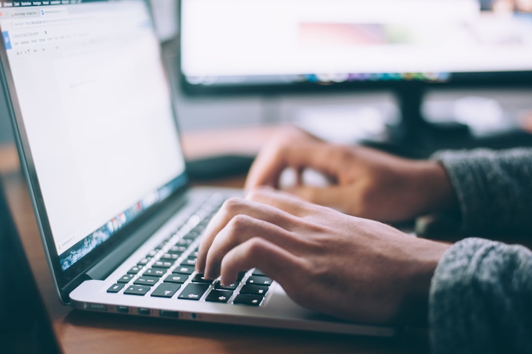 person using MacBook Pro for career and professional skills
